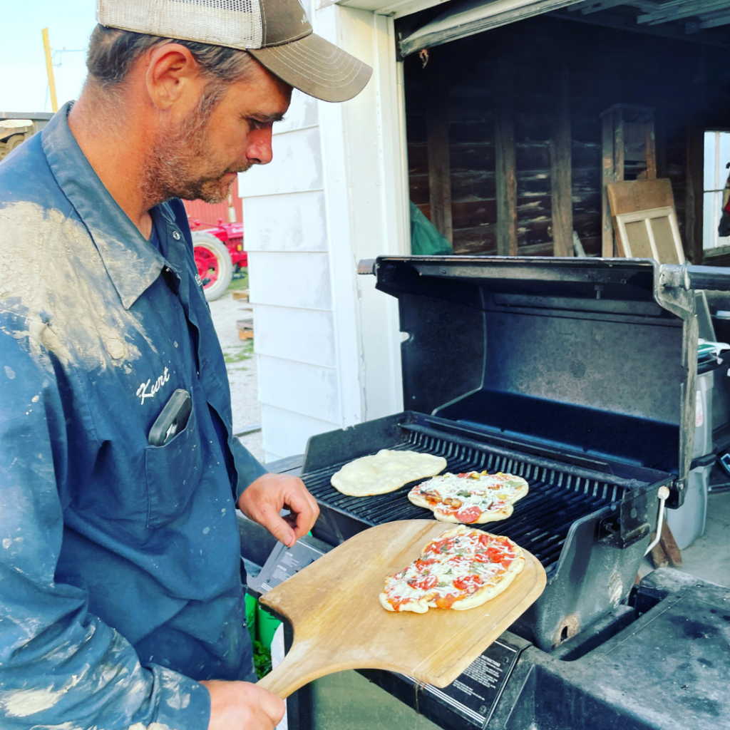 Kurt making pizza